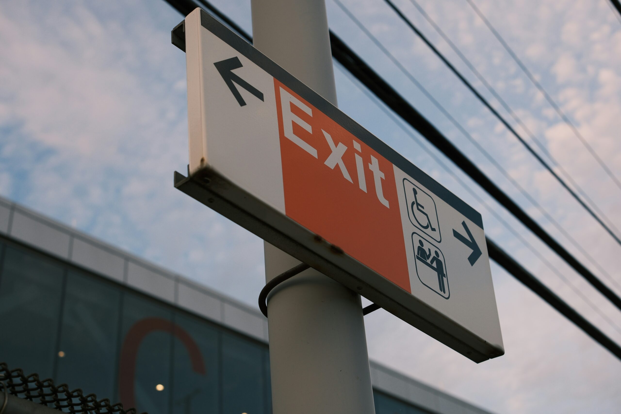 Exit sign points the way.