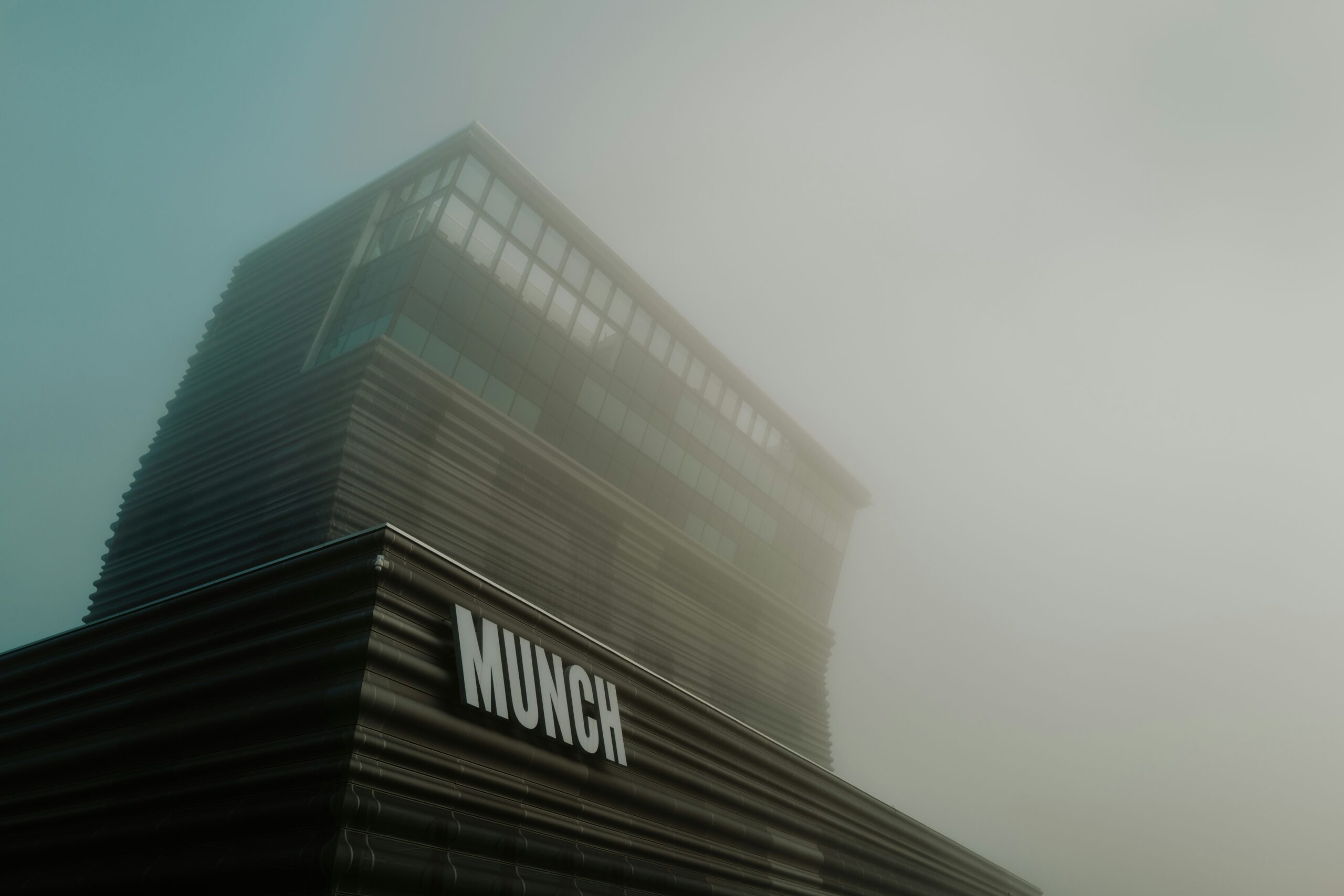 A picture of a building in the fog
