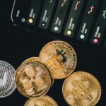 Close-up view of various cryptocurrency coins with a digital market display in the background.