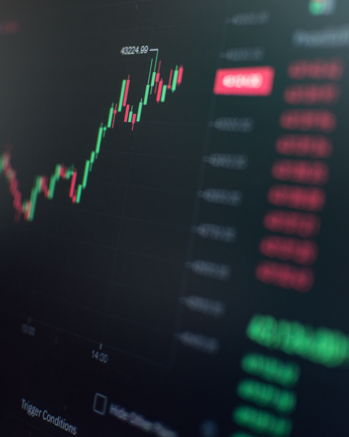 Close-up of a fluctuating cryptocurrency market chart showing stock prices on a digital screen.